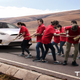 Image for article titled Elon Musk Unveils New Clean Energy Luxury Car Pulled By 8 Tesla Employees